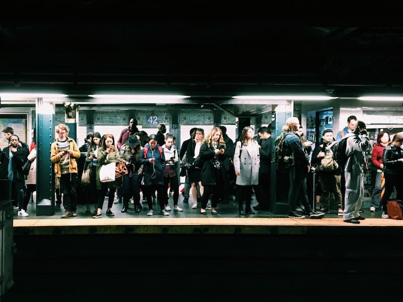 A crowded subway platform where no one is connecting